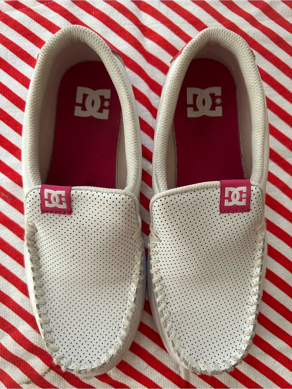 DC Women’s White Slip-On Sneakers with Pink Accents